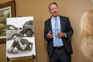Personal injury attorney tom mccutcheon meets with a client to examine a neck injury claim.