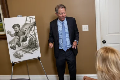 Personal injury attorney tom mccutcheon meets with a client to review a child injury case.