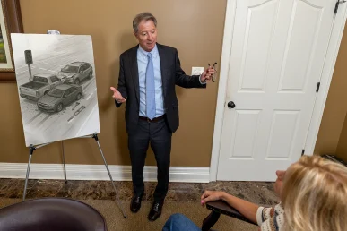 Personal injury attorney tom mccutcheon meets with a client to review a traffic accident case.