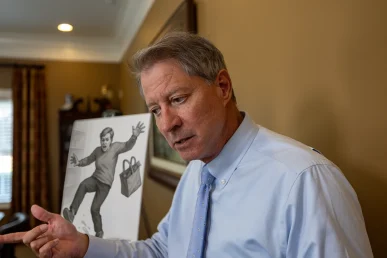 Personal injury attorney tom mccutcheon talks with a client about a slip and fall accident case.