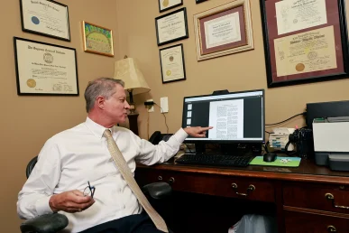 Tom mccutcheon and joel hamner consult on a serious internal organ injury claim.