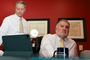 Tom mccutcheon and joel hamner meet with a client to discuss a defective toy or playpen injury case.
