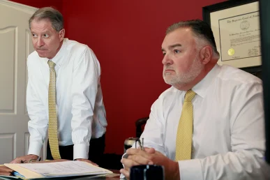 Tom mccutcheon and joel hamner meet with a client to discuss a recreational vehicle accident lawsuit.