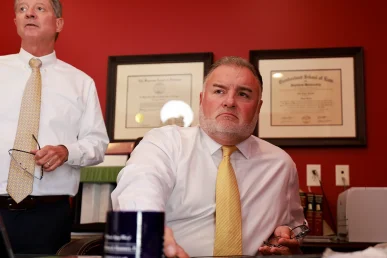 Tom mccutcheon and joel hamner meet with a client to discuss diagnostic scans for a cervical injury case.