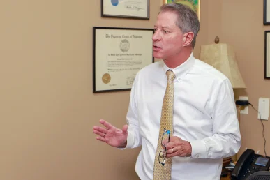 Tom mccutcheon and joel hamner meet with a client to review a doordash delivery accident claim.