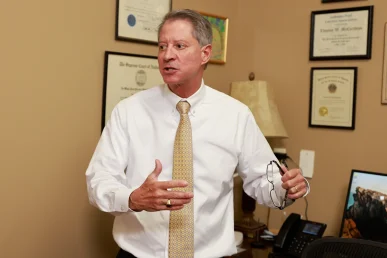 Tom mccutcheon and joel hamner meet with a client to review a fire related accident claim.
