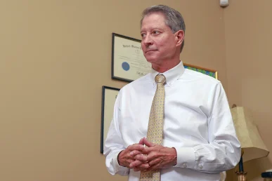 Tom mccutcheon and joel hamner meet with a client to review a self driving vehicle accident case.