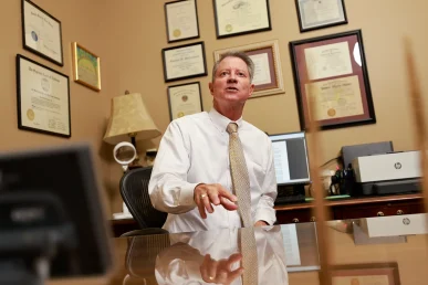 Tom mccutcheon and joel hamner strategize over a city bus or rail collision case.