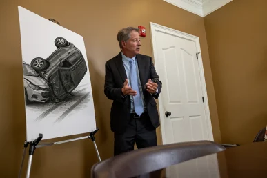 Tom mccutcheon consults with a client to review a rollover accident claim.