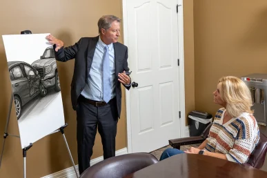 Tom mccutcheon meets with a client to evaluate a passenger injury claim.