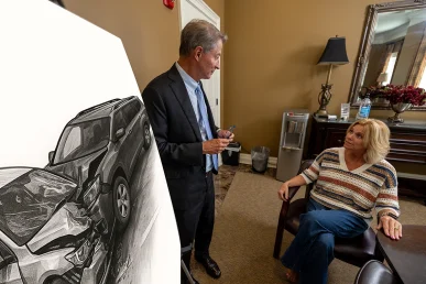 Tom mccutcheon meets with a client to review a t bone accident claim.