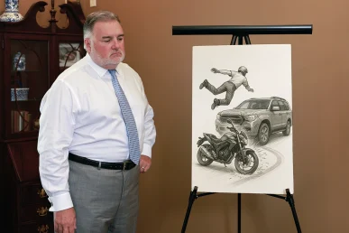 Attorney Joel Hamner discusses a motorcycle accident exhibit showing a rider being hit by a vehicle in Huntsville, Alabama.