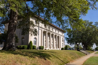 Historic Florence courthouse framed by surrounding trees