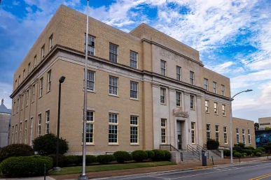 The Historic Huntsville federal courthouse viewed from the front right angle, showcasing its architecture and surroundings.
