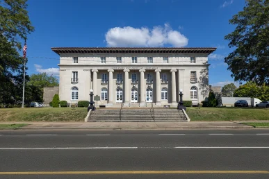 Front lawn of the old Florence Alabama courthouse with trees and grass