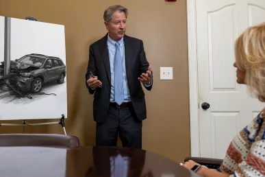 Personal injury attorney Tom McCutcheon meets with a client considering a lawsuit for an Huntsville drunk driving accident.