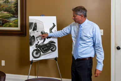 Tom McCutcheon talking with a client about motorcycle accidents in Florence Alabama
