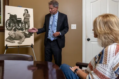 Tom McCutcheon talking with a client about nursing home abuse case in Florence Alabama