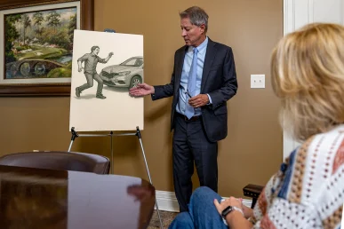 Tom McCutcheon with client discussing a pedestrian accident case that occurred in Florence Alabama.
